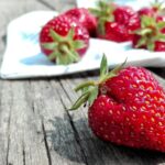 strawberries on top of brown table