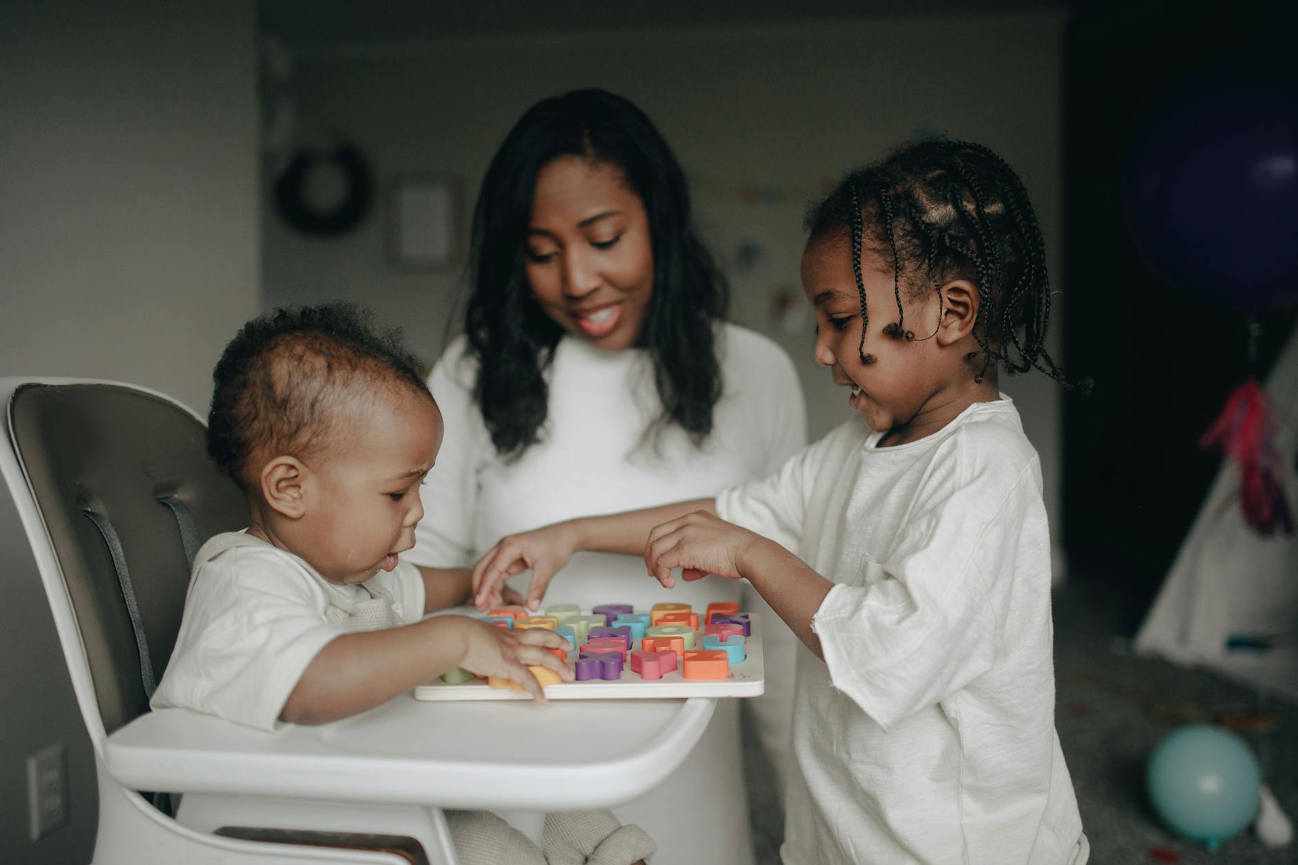 mum and kids playing blocks